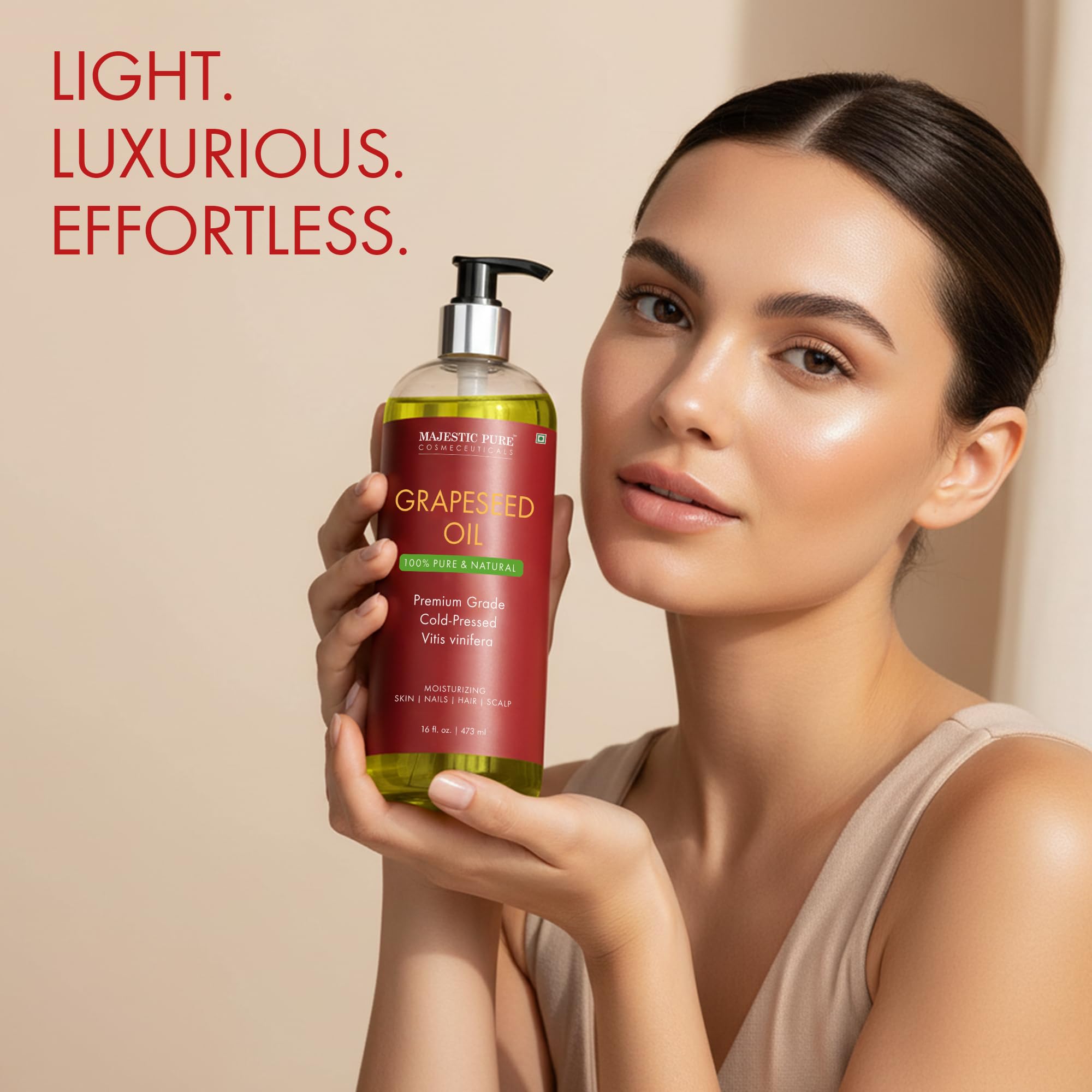 Majestic Pure grapeseed oil skin-care application on hands and arms for hydration.