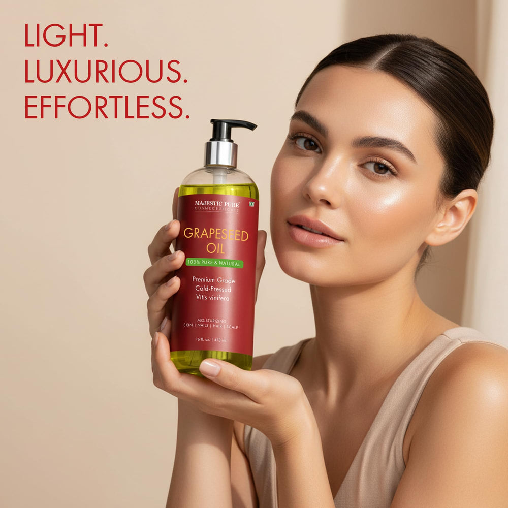 Majestic Pure grapeseed oil skin-care application on hands and arms for hydration.