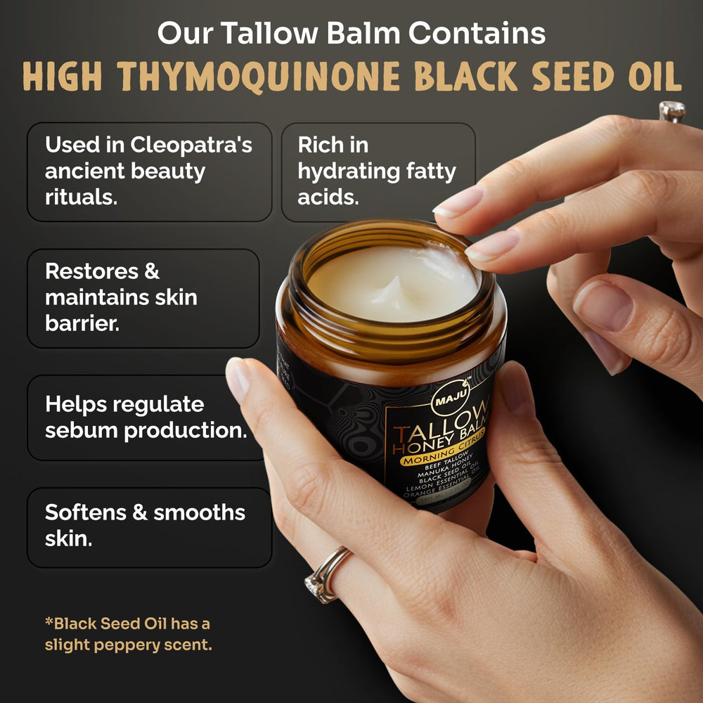 Black seed oil bottle beside balm for antioxidant skin support