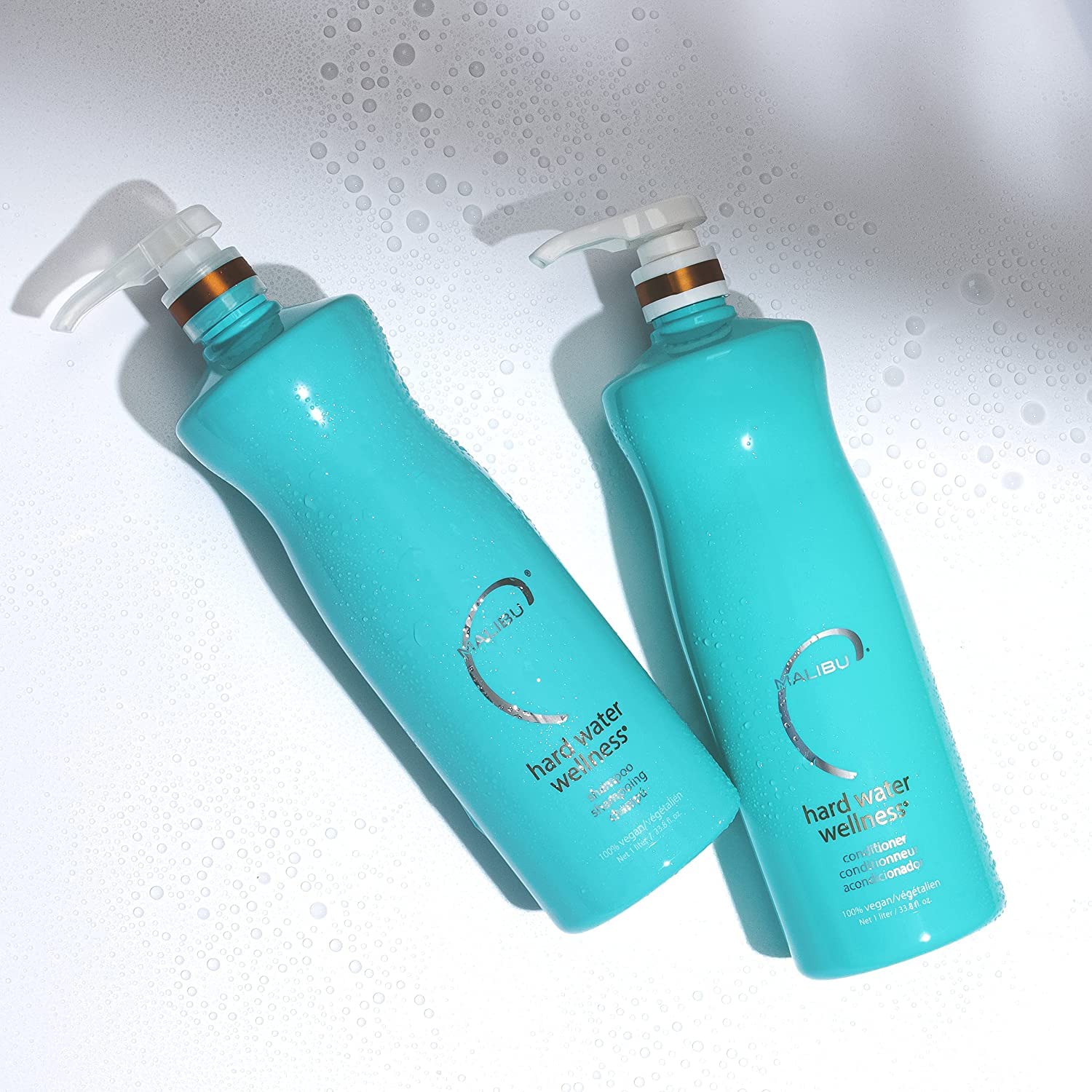 Malibu C Hard Water Wellness bottle pour shows easy application for even distribution.
