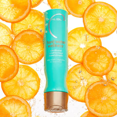 Malibu C Hard Water Wellness Conditioner label closeup highlights vegan plant-based nourishment.