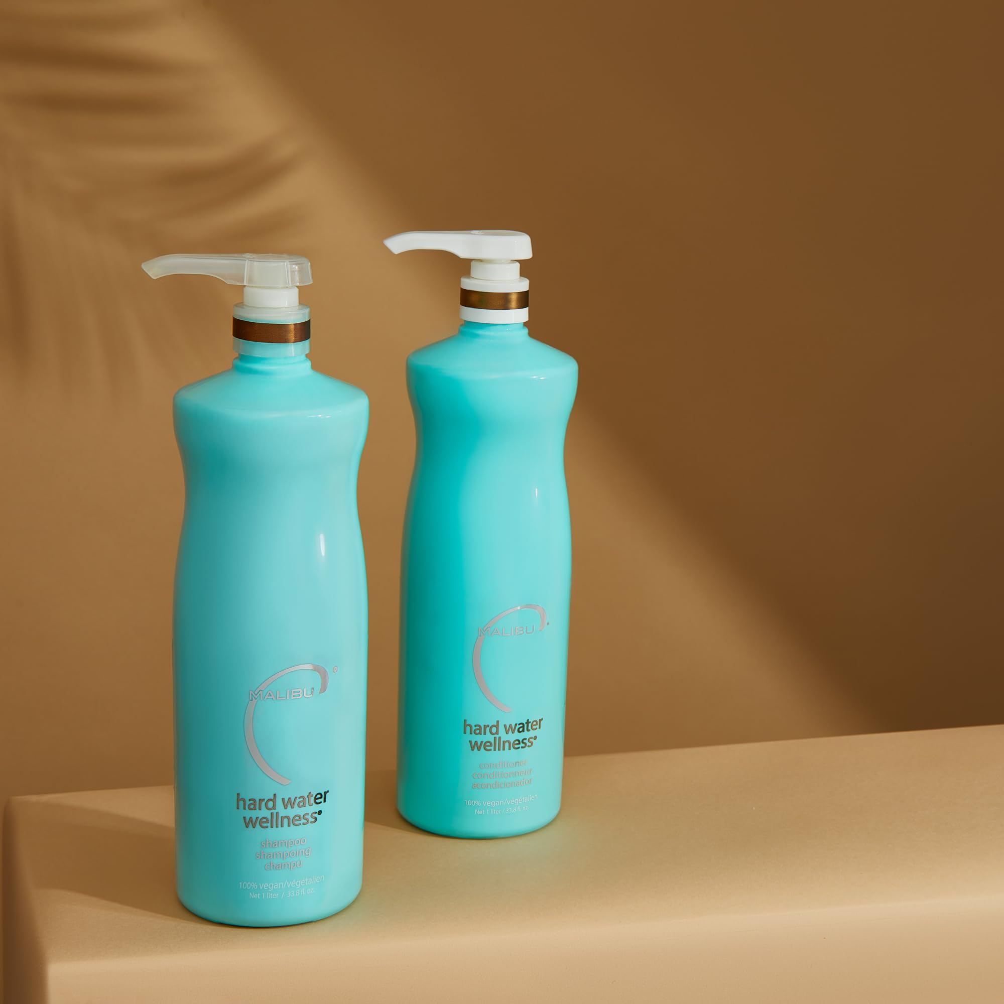 Malibu C conditioner in shower scene emphasizes protection from waterborne elements.