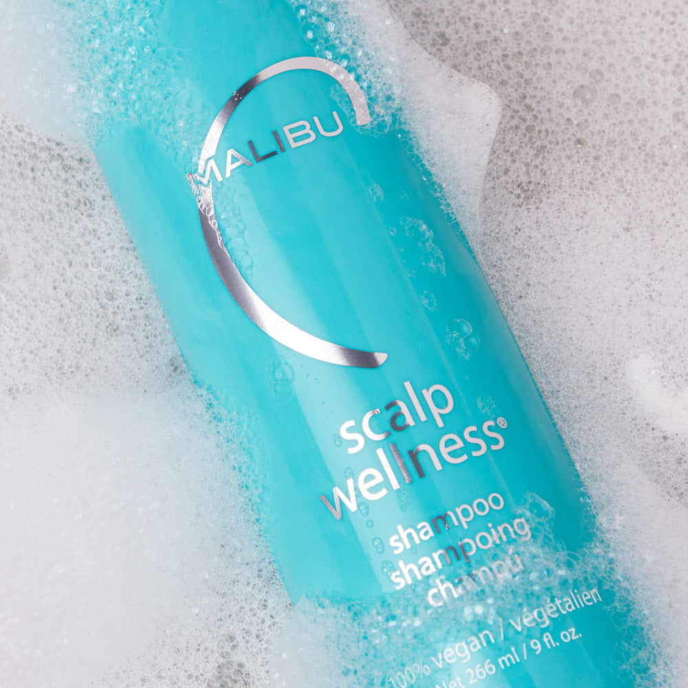 Malibu C Scalp Wellness shampoo lather closeup illustrating creamy cleansing foam.