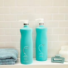 Malibu C Scalp Wellness Shampoo bottle closeup highlighting vegan formula.