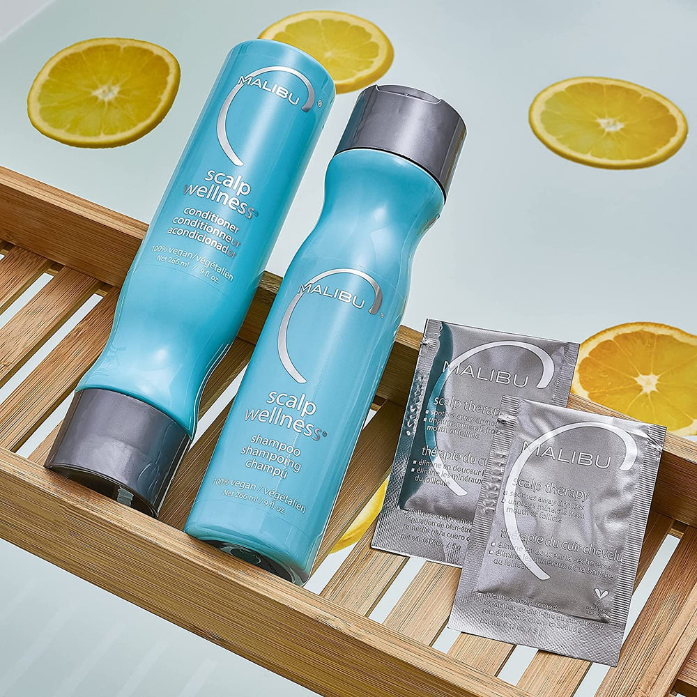 Malibu C Scalp Wellness Shampoo tub open with product texture.