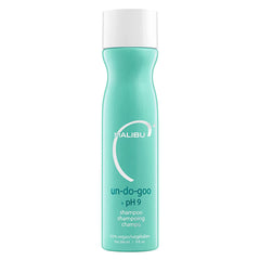Malibu C Un-Do-Goo bottle anti-residue demonstrates buildup removal for shinier hair.