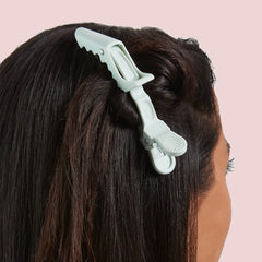 Mane All Grip No Slip teal and pink set on dresser ready for quick styling prep