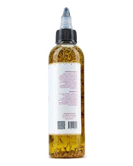 The Mane Attraction rosemary-fenugreek oil dropper bottle ready for precise application.