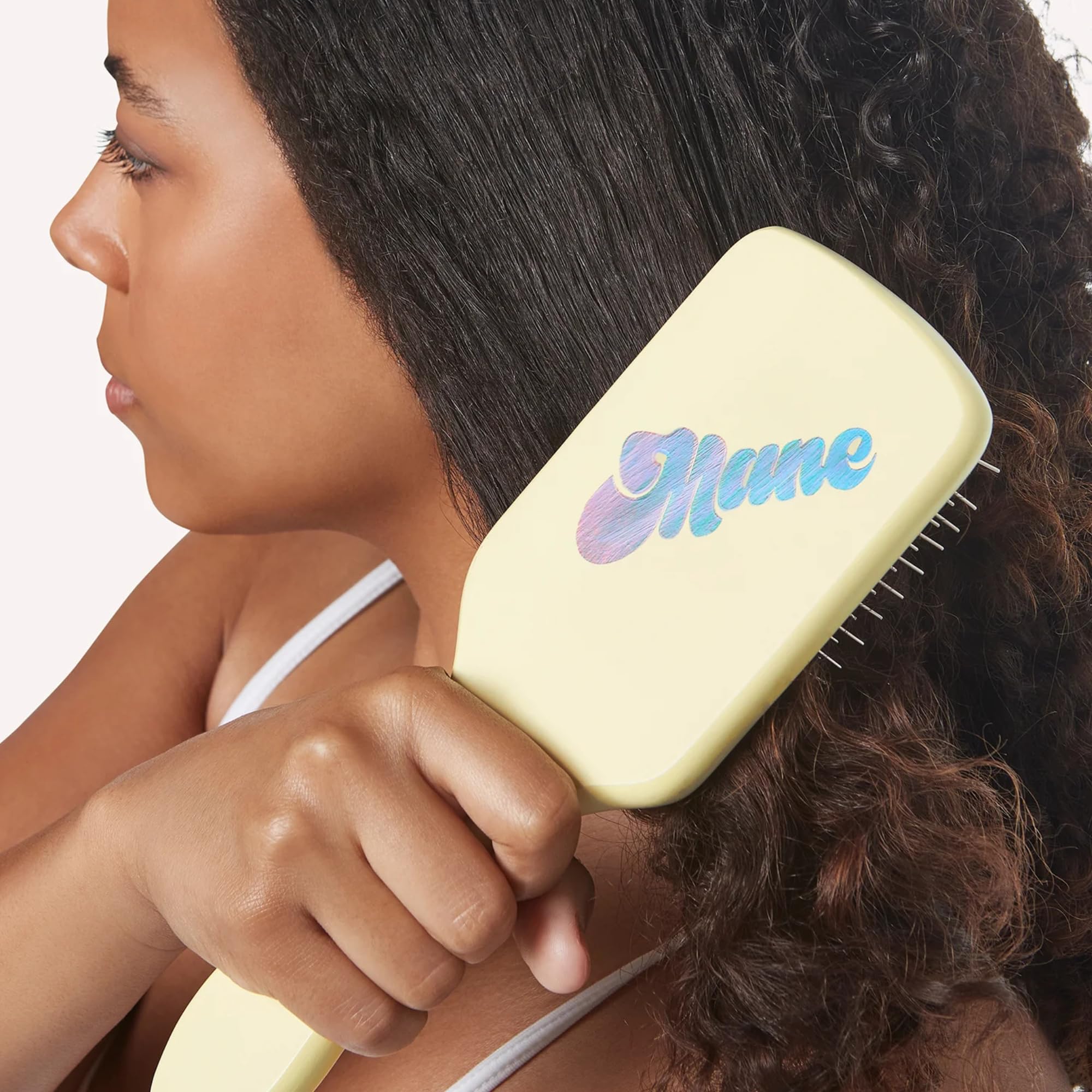 Mane Ready or Knot brush showing anti-static bristles for frizz control