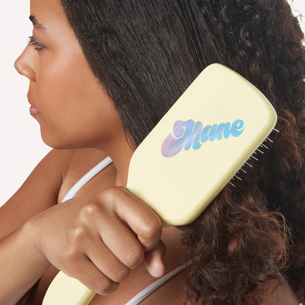 Mane Ready or Knot brush showing anti-static bristles for frizz control