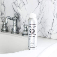 Mane Tame bottle highlights built-in UV protection for color care.