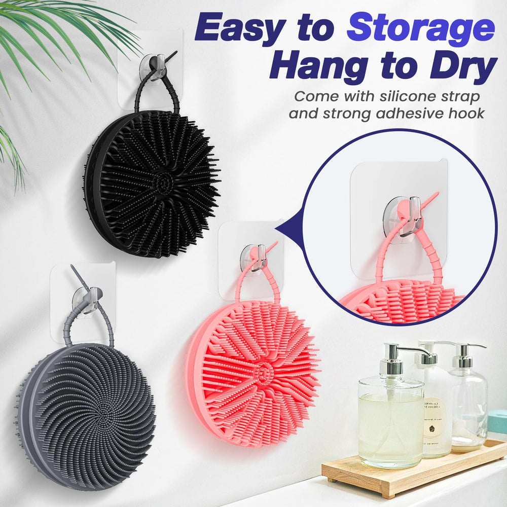 Manmihealth dual-sided silicone body scrubber drying ready with strap and hook for easy storage.