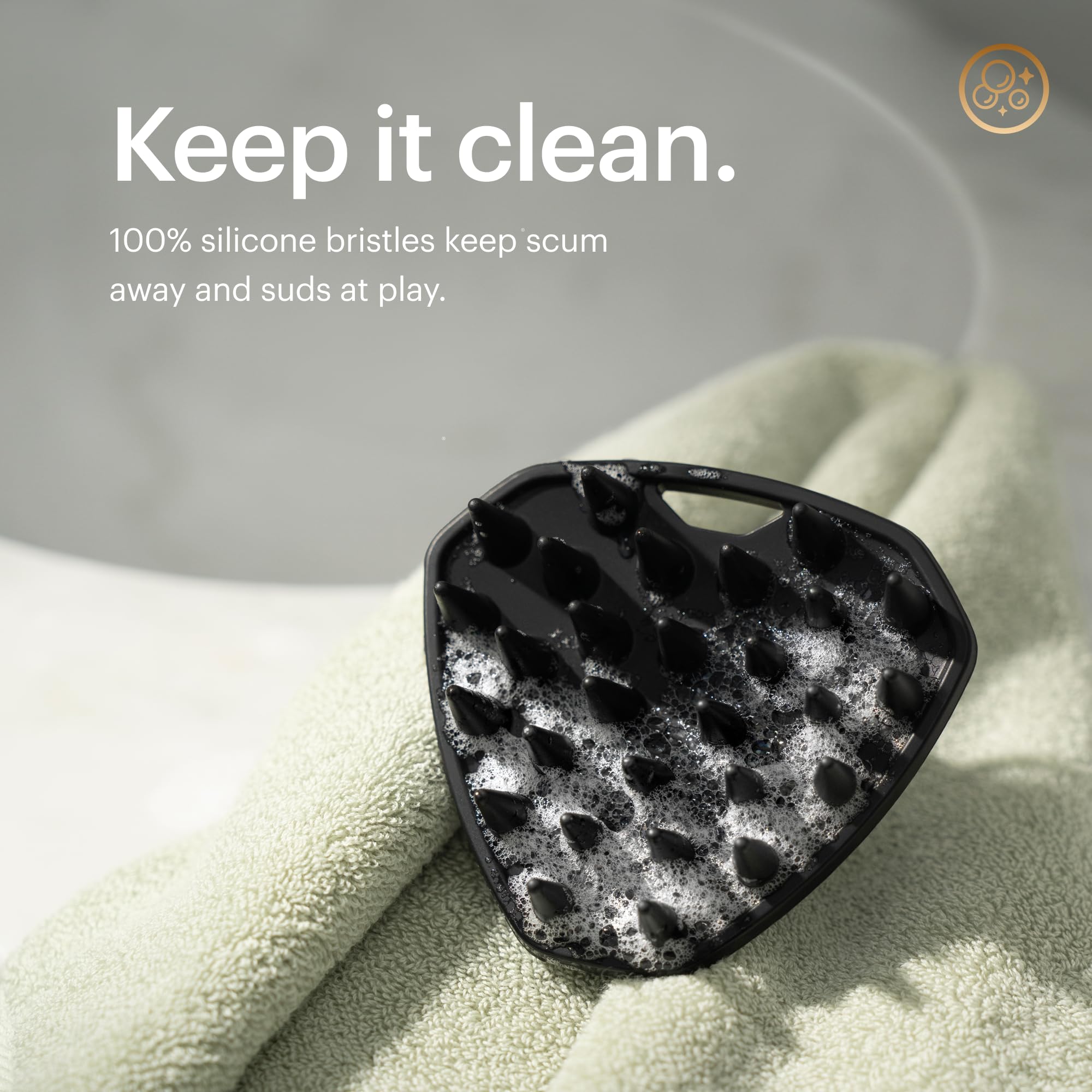 MANSCAPED Scalp Buffer round-tip bristles illustrate penetrating scrub for roots.