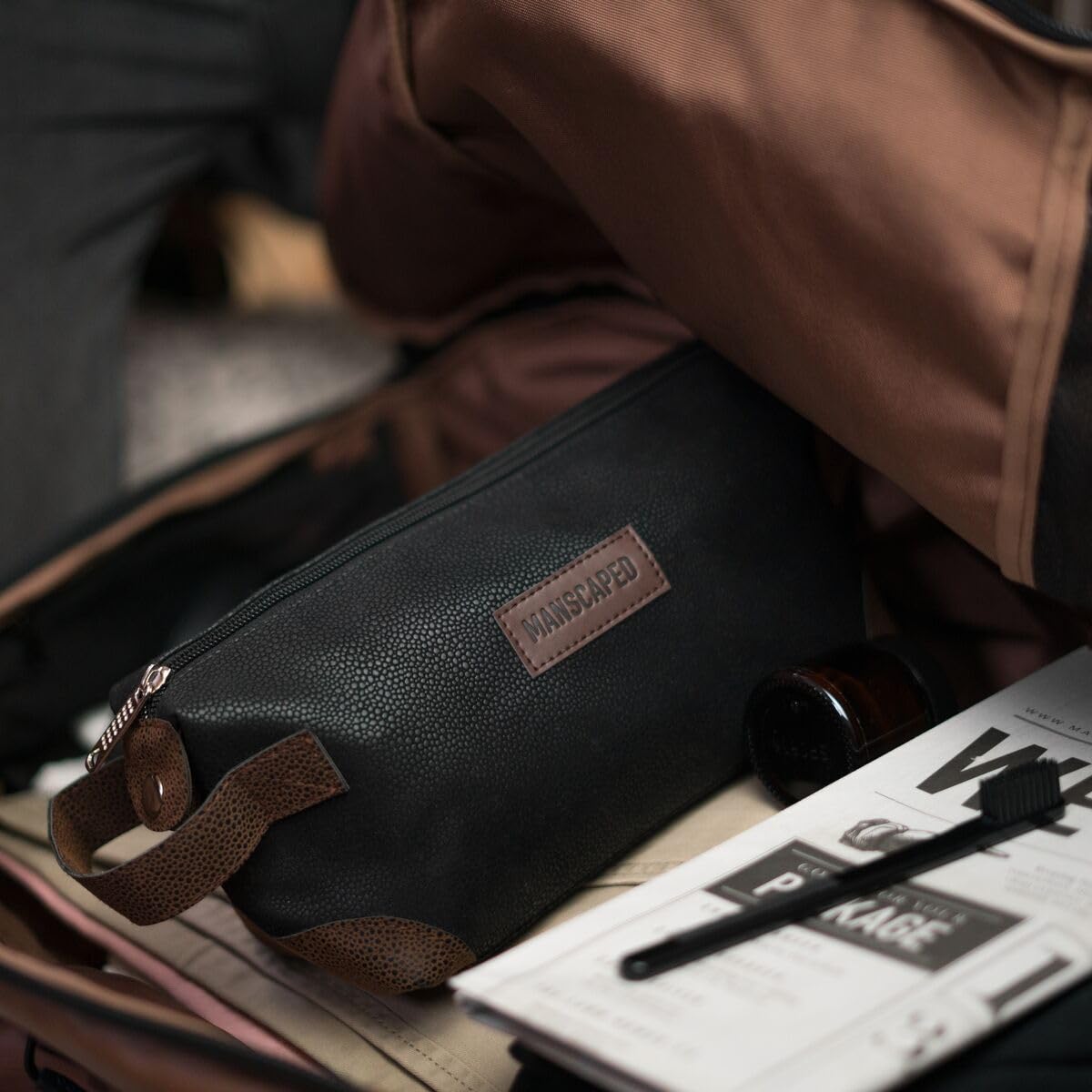 MANSCAPED Shed bag grab-and-go handle simplifies packing for trips.
