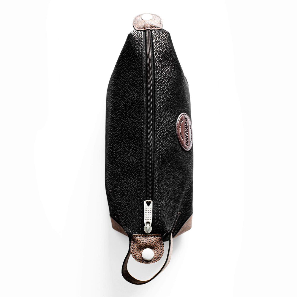 MANSCAPED Shed bag water-resistant material protecting trimmers during travel.