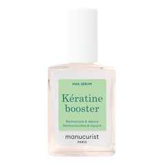 Manucurist Keratin Booster bottle applied to nails for stronger, nourished nails.