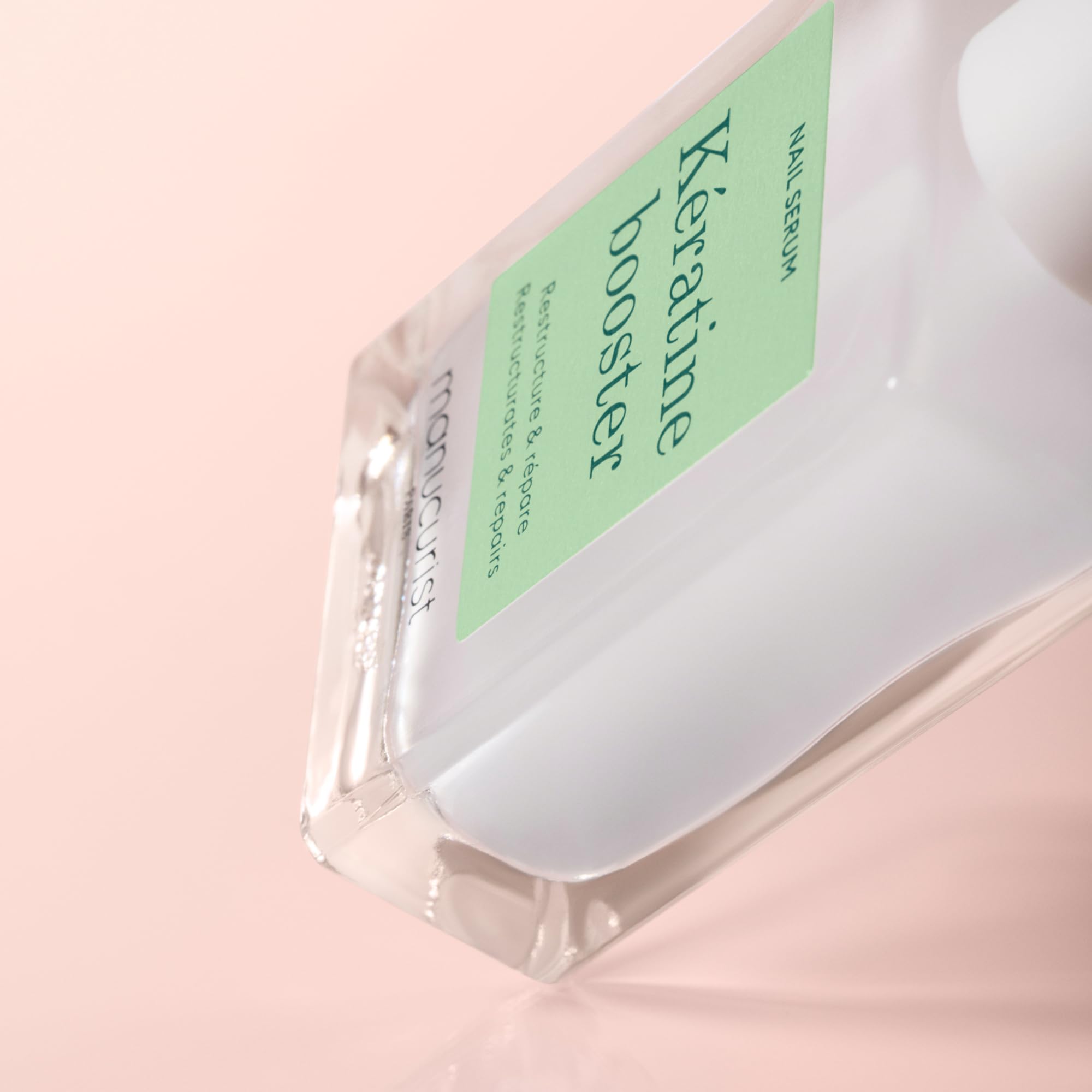 Manucurist Keratin Booster packaging close-up highlighting natural-origin formula.