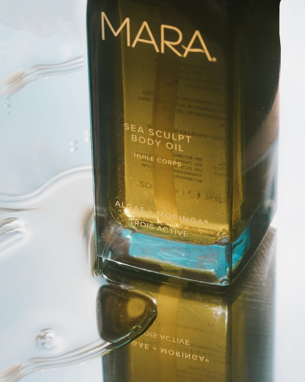 MARA Sea Sculpt Body Oil luxury-spa setup evokes premium pampering and visible glow.