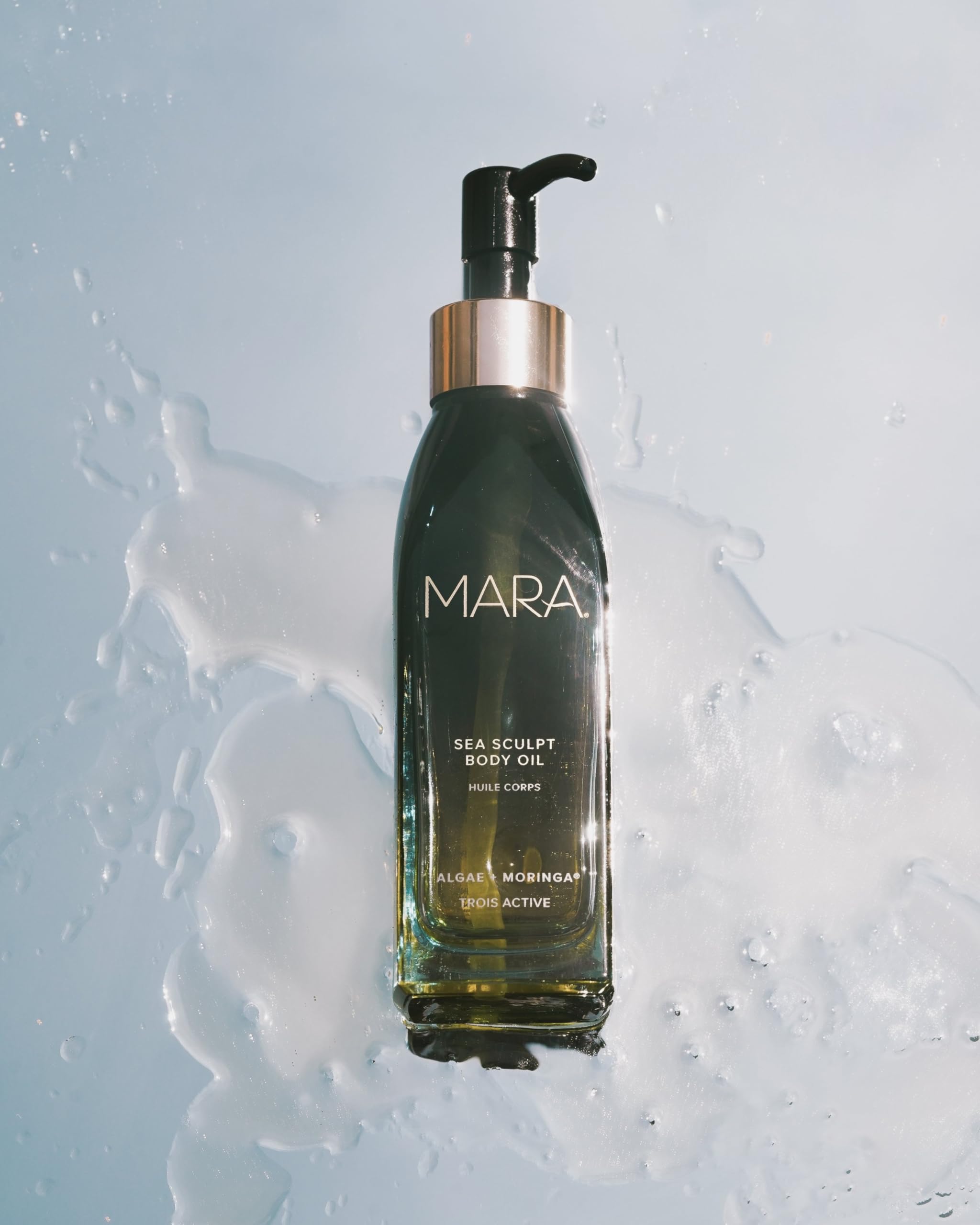 MARA Sea Sculpt Body Oil pump-dispense shot shows easy application and quick absorption.