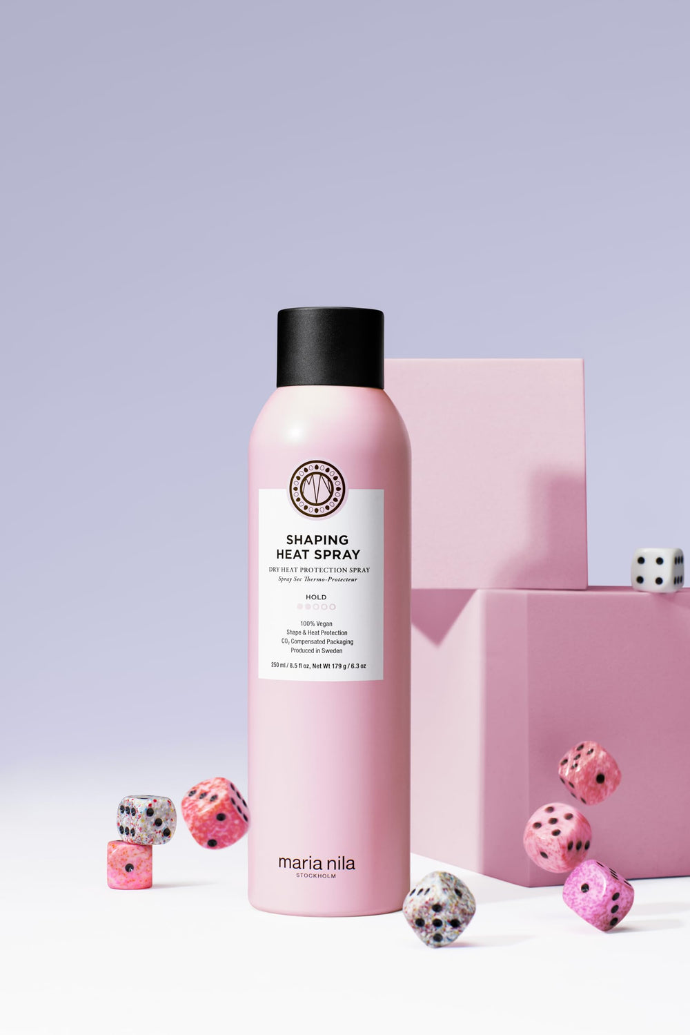 Maria Nila Shaping Heat Spray being applied to dry hair for pre-styling protection