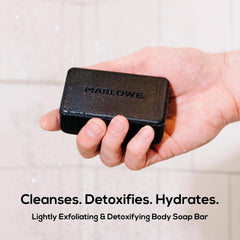 MARLOWE charcoal soap foam close-up highlighting rich lather and purifying cleanse.