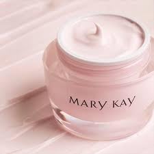 Mary Kay Intense Moisturizing Cream on nightstand beside soft, moisturized skin.