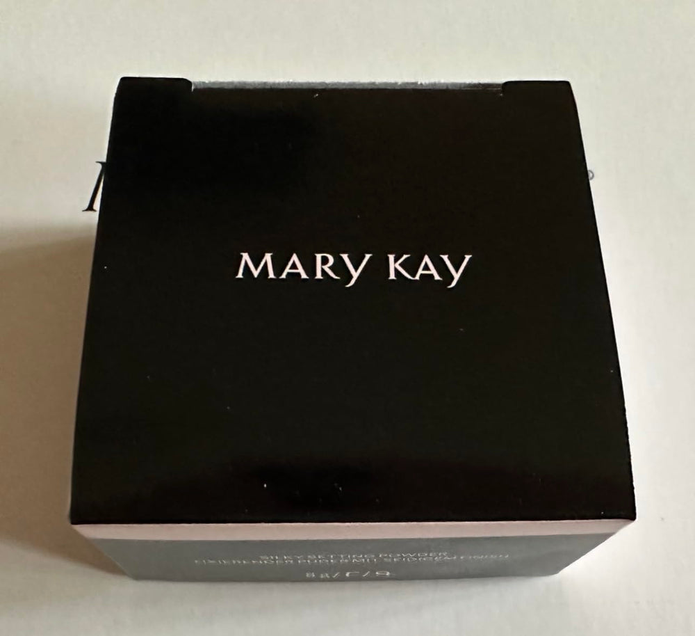 Mary Kay Silky Setting Powder applied with brush for even, shine-minimized coverage