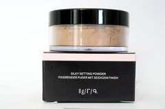 Mary Kay Silky Setting Powder being applied with a brush for smooth blending.