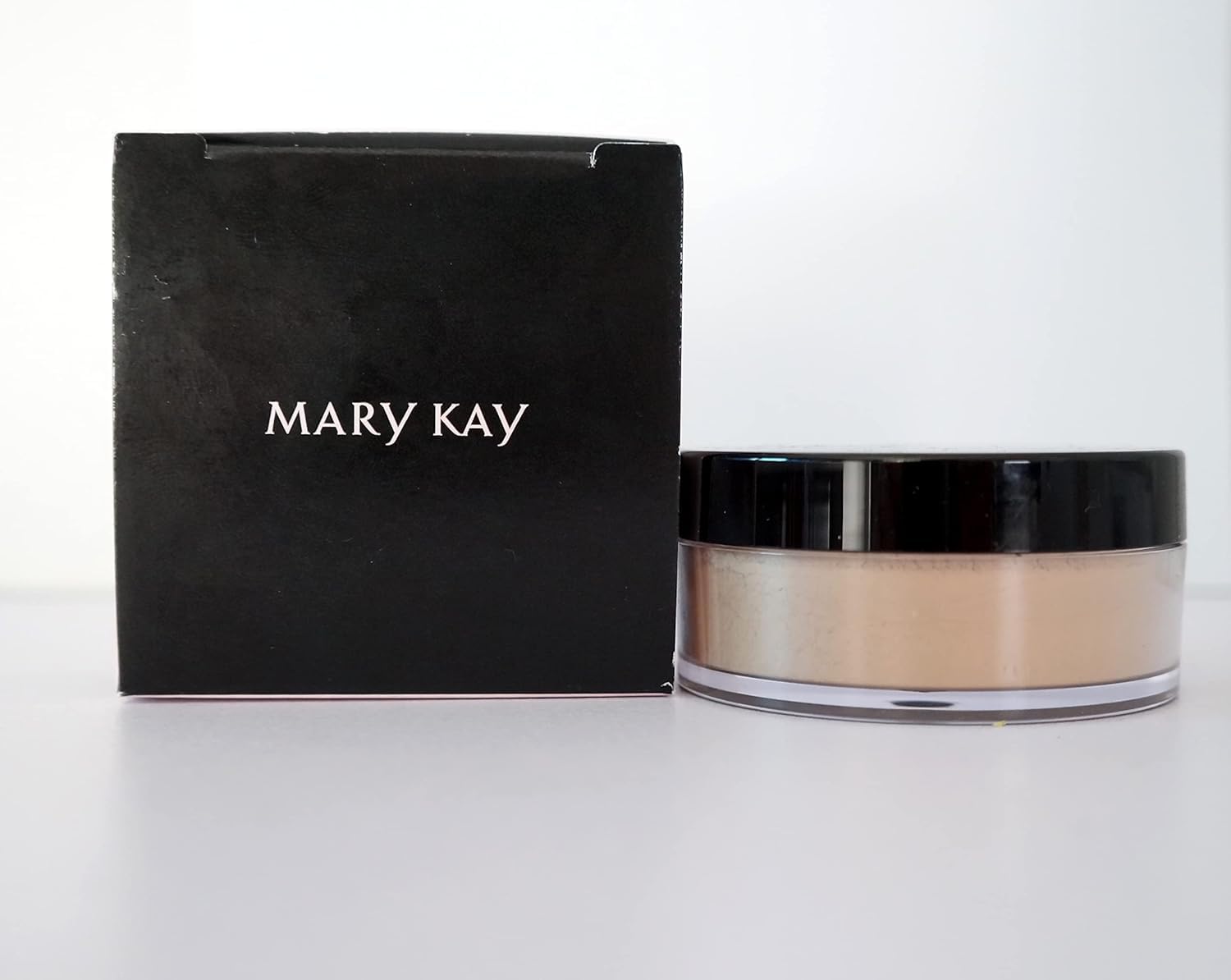 Mary Kay Silky Setting Powder compact front view for portable shine control.