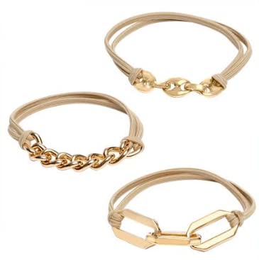 Maya J bracelet hair ties on wrist in beige-black elastic, adding subtle polish to any outfit