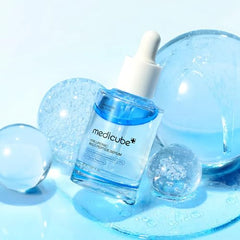 Medicube serum layer mixer action demonstrates shaking the dual-layer formula.