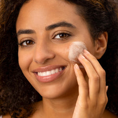 Medik8 Surface Radiance Cleanse with AHA/BHA exfoliates to smooth skin texture.