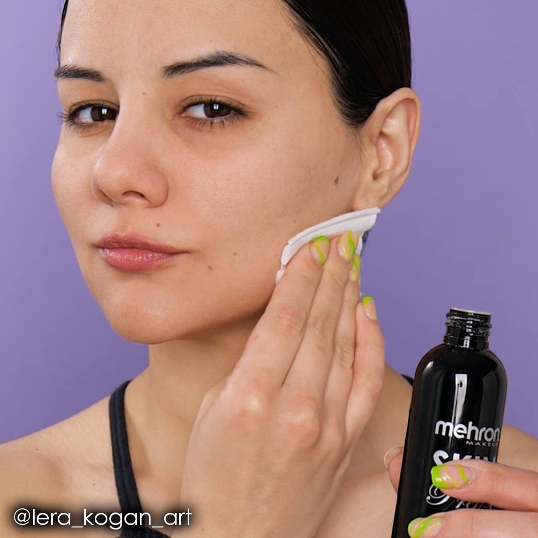 Mehron Skin Prep Pro matte finish demo bottle and brush in professional setup.