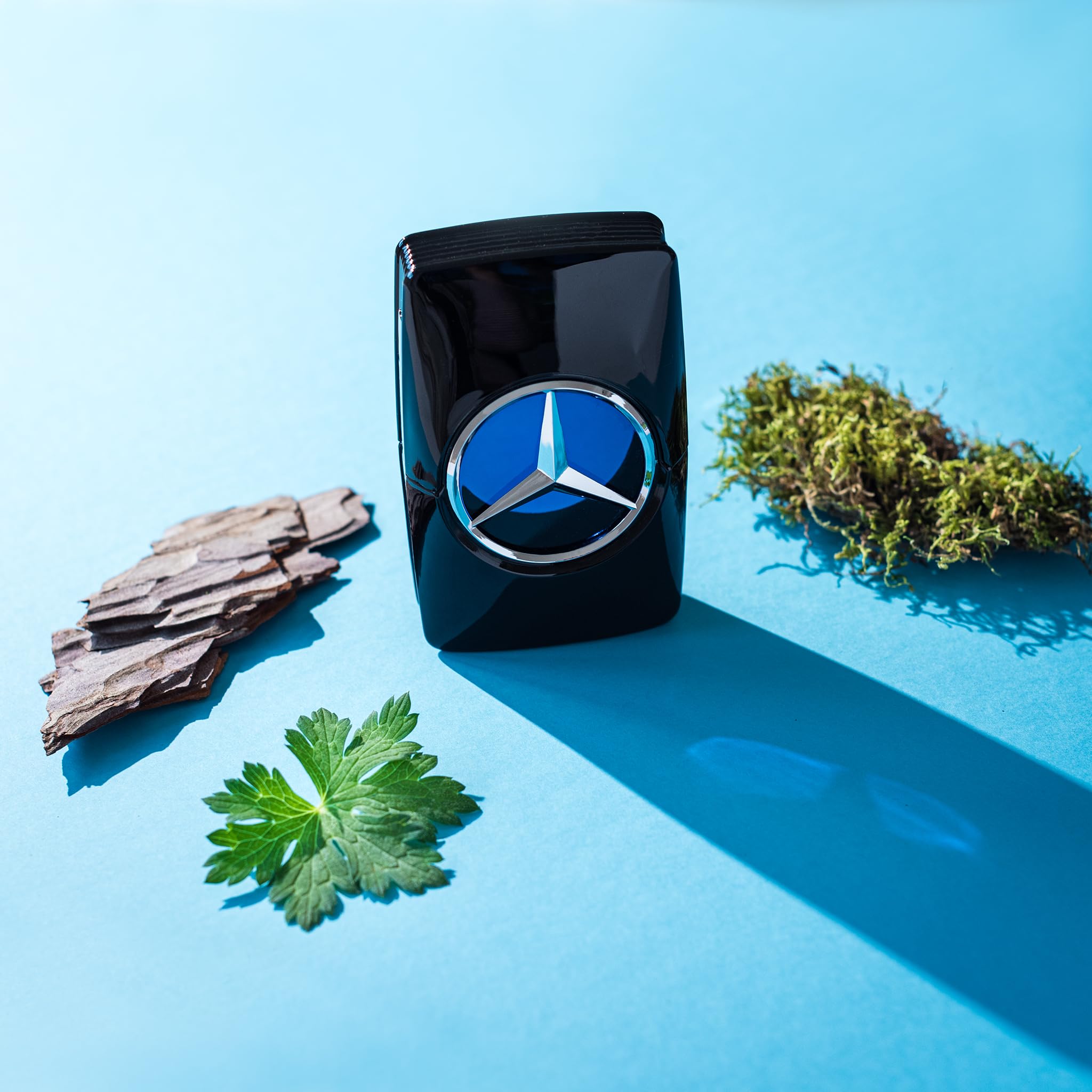 Mercedes-Benz Man Intense woody-amber base closeup communicates lasting aroma and confidence.