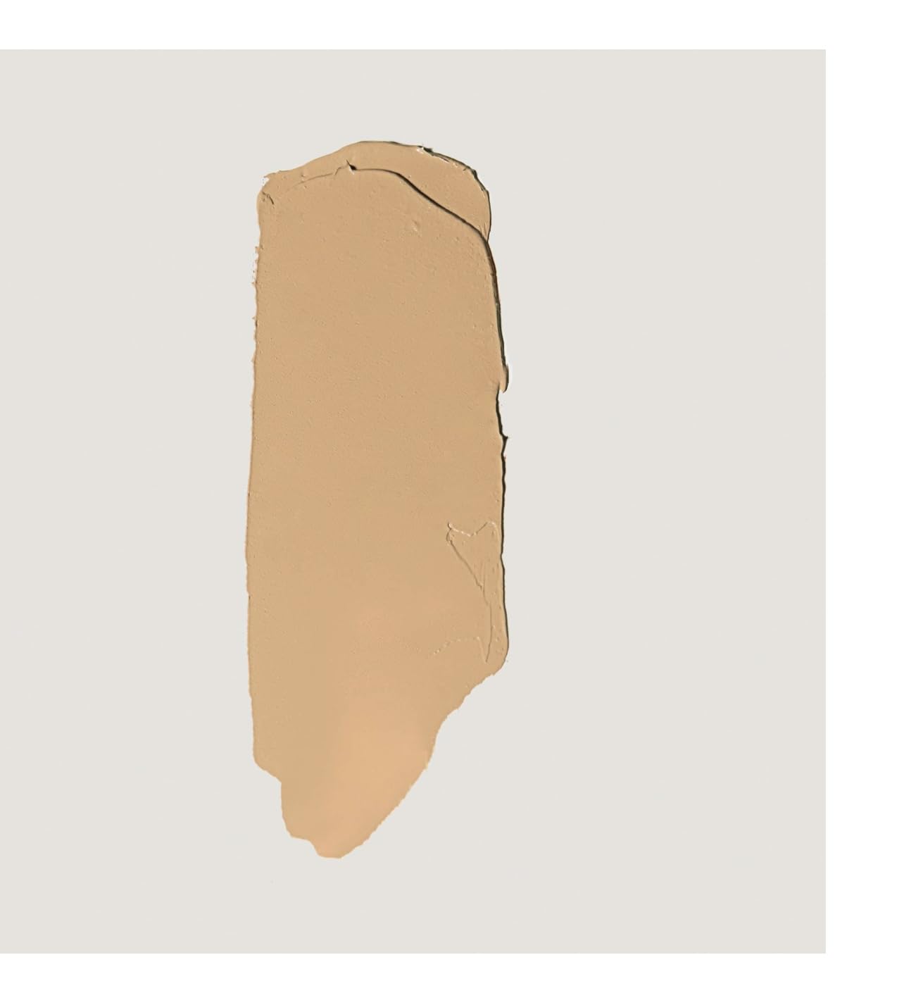 Merit Minimalist Camel packaging close-up highlighting durable, travel-friendly design.