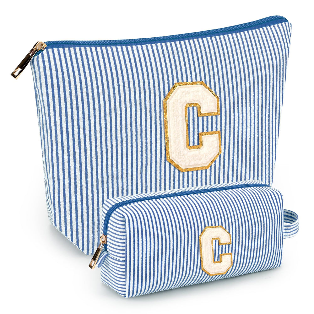 Bolsa inicial de mibasies azul, ideal para viajar y mantener el maquillaje ordenado.