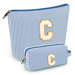 Bolsa inicial de mibasies azul, ideal para viajar y mantener el maquillaje ordenado.