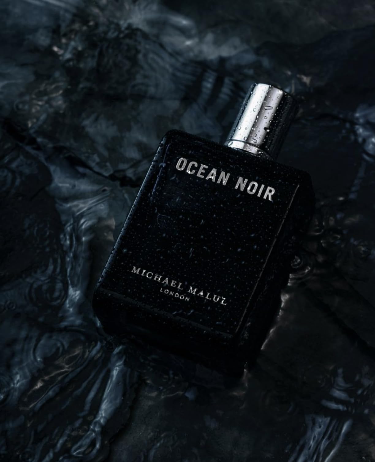 Michael Malul Ocean Noir bottle-closecap highlights premium design.
