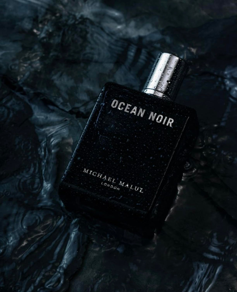 Michael Malul Ocean Noir bottle-closecap highlights premium design.