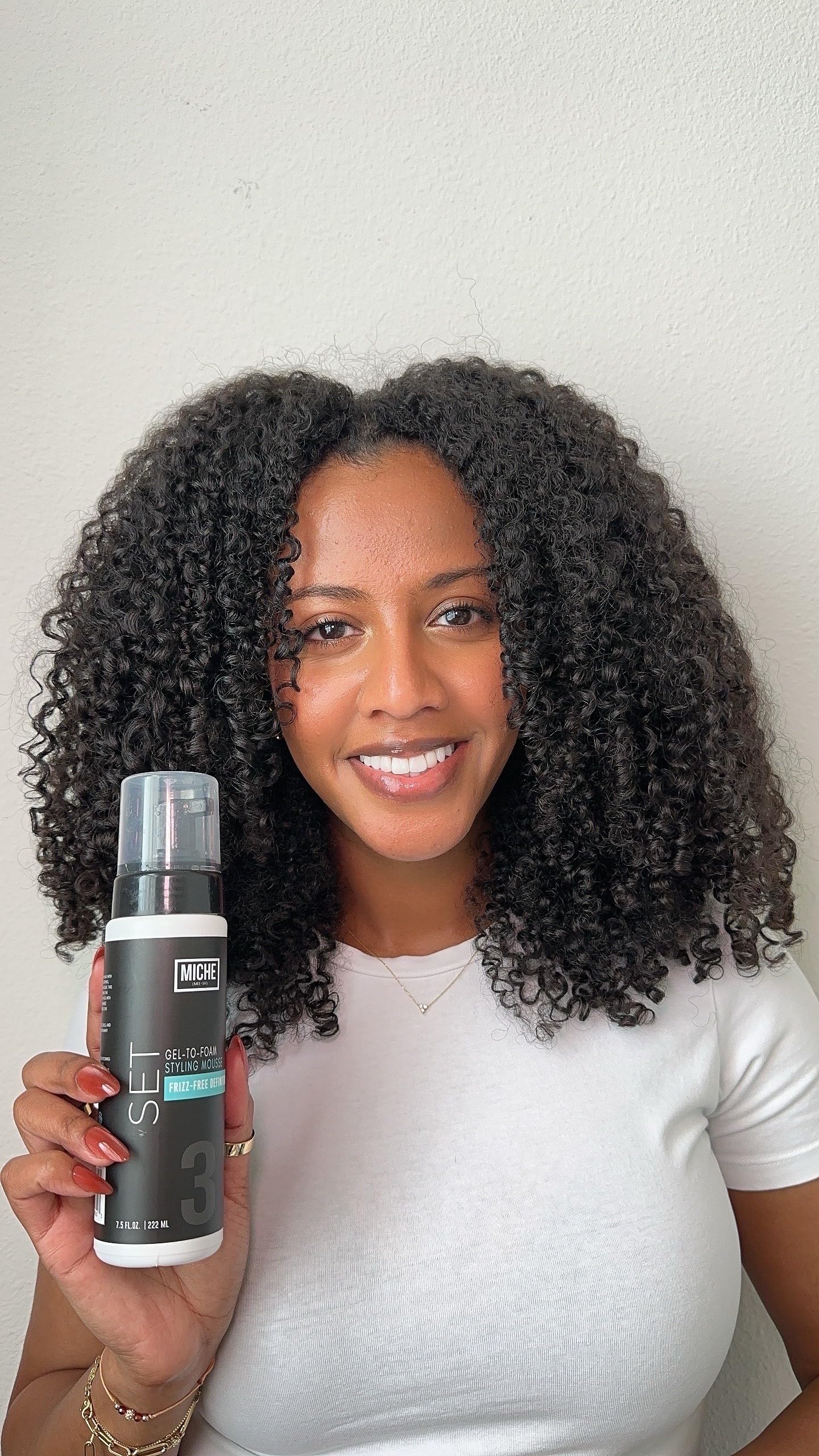 Miche Beauty Set Gel to Foam Mousse on curl-ready hair illustrates frizz control potential.