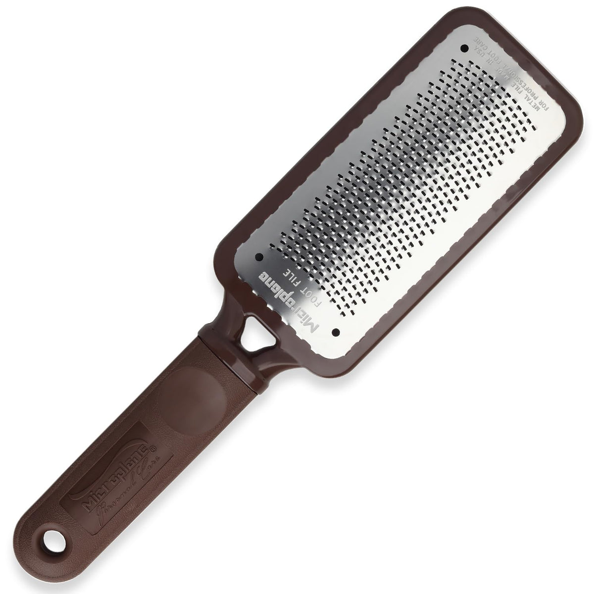 Microplane Colossal Foot File rasp edge close-up emphasizes ultra-sharp stainless steel for dead skin removal.