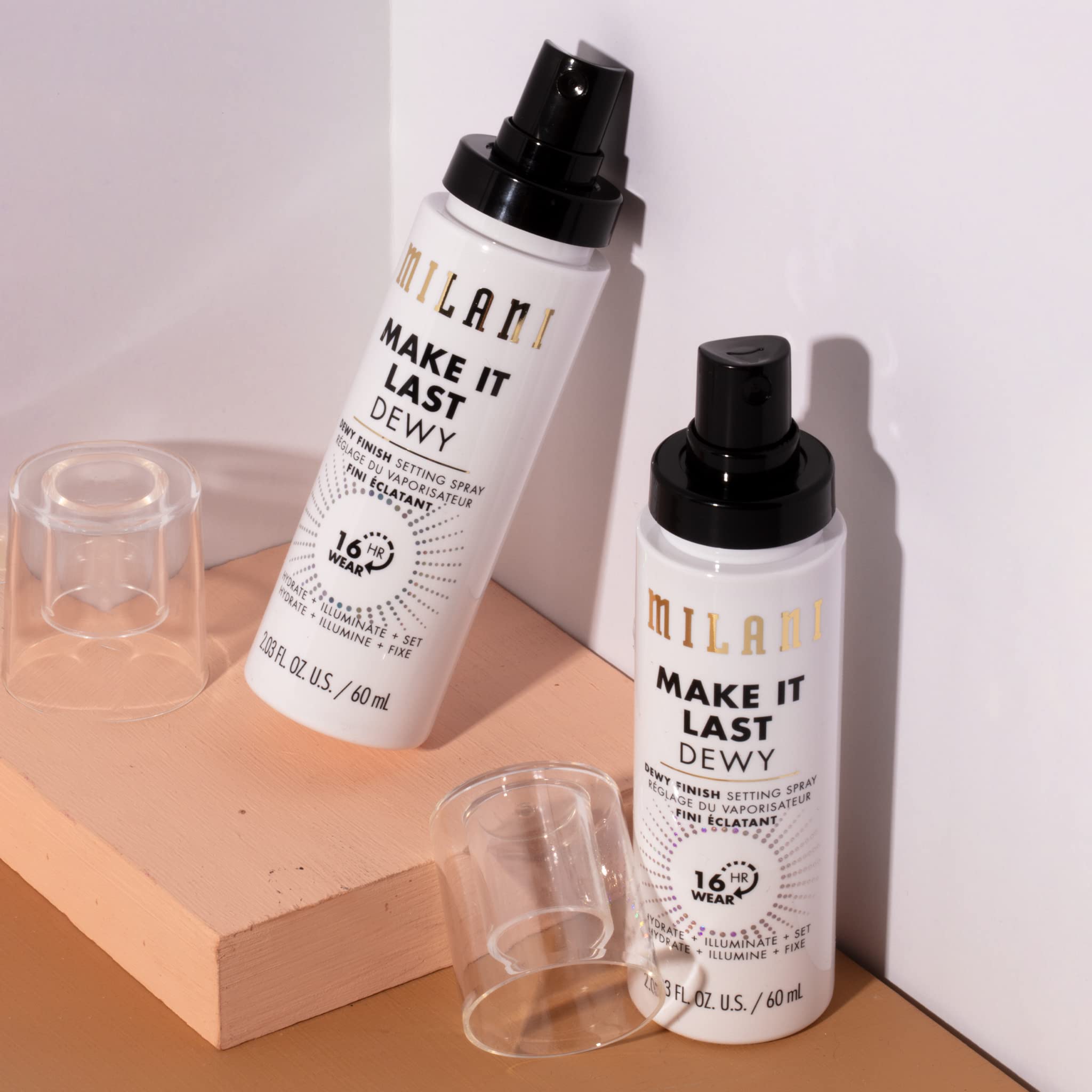 Milani Make It Dewy setting spray mist on cheek delivers instant dew.