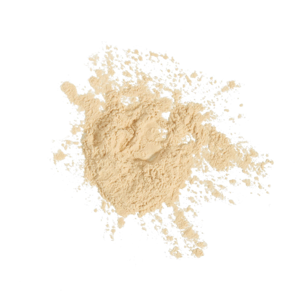 Milani pore-blurring finish on skin close-up showing diffused texture.
