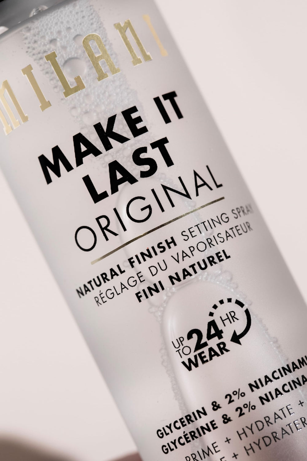 Milani Setting spray after makeup use image suggests sealing and longevity