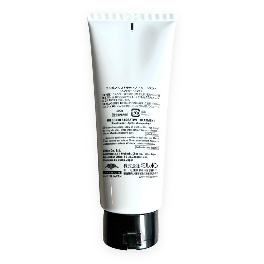 Milbon Repair Restorative Treatment application swatch on hair mid-lengths demonstrates repair-ready results.