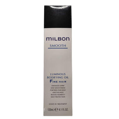 Milbon Smooth Luminous Bodifying Oil application scene showing hands applying for even distribution for smoother styling.