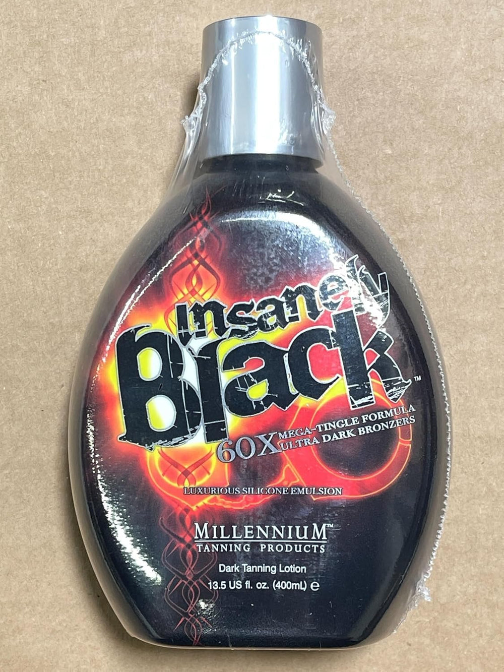 Millennium Tanning Insanely Black 60x packaging on shelf emphasizes value and brand recognition.