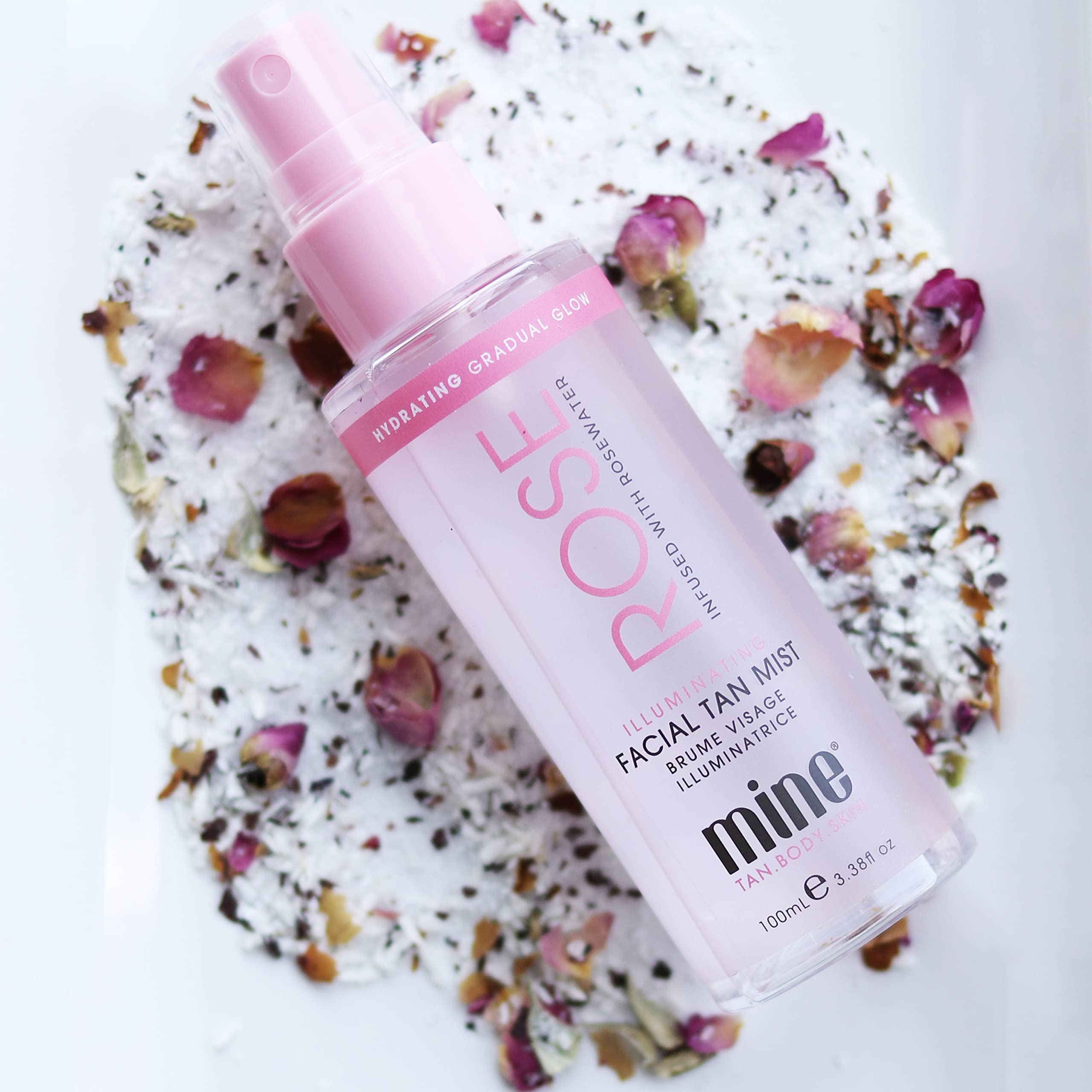 Minetan Rose Face Tan Mist spray in action for seamless application