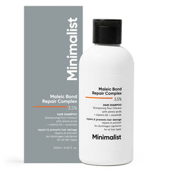Minimalist hair shampoo bottle pour showing bond repair potential for damaged hair