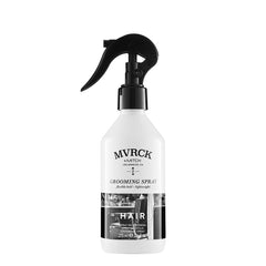 MITCH MVRCK grooming spray bottle being dispensed for flexible hold and natural shine.